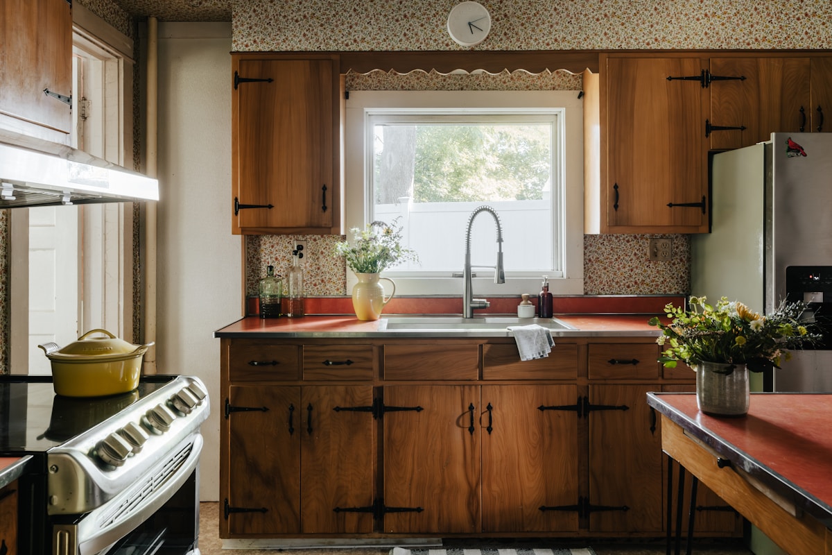 A dated kitchen before remodeling, with older cabinets and countertops